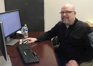 David Gray working at his desk, David Gray, employee spotlight, Timberhaven employees, staff recognition
