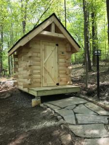 logo cabin outhouse, log cabin loo, log outhouse, log loo, outhouse off the grid, unique outhouse, unique log cabin, log cabin home, log cabins, log homes, timber frame homes, Engineered Logs, Timberhaven Log & Timber Homes