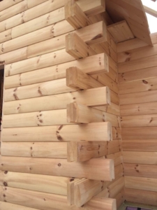 log stack with mortise and tenon corners, suggestions for building a log home in the winter, log homes, log home under construction, log cabins, winter build, Timberhaven, kiln dried logs, engineered logs
