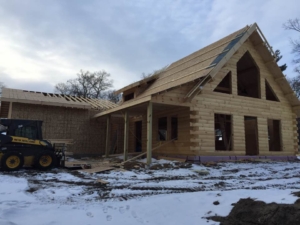 roof installation log cabin, suggestions for building a log home in the winter, log homes, log home under construction, log cabins, winter build, Timberhaven, kiln dried logs, engineered logs