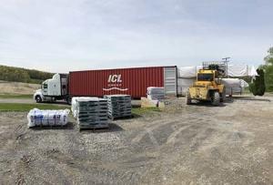 materials being loaded onto a sea container, log home package, international distribution, international delivery, log home delivery, delivery day, netherlands log home, kiln dried, heat treated, Timberhaven