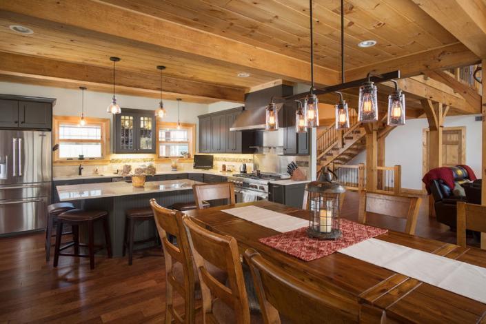 Open timber frame dining and kitchen area