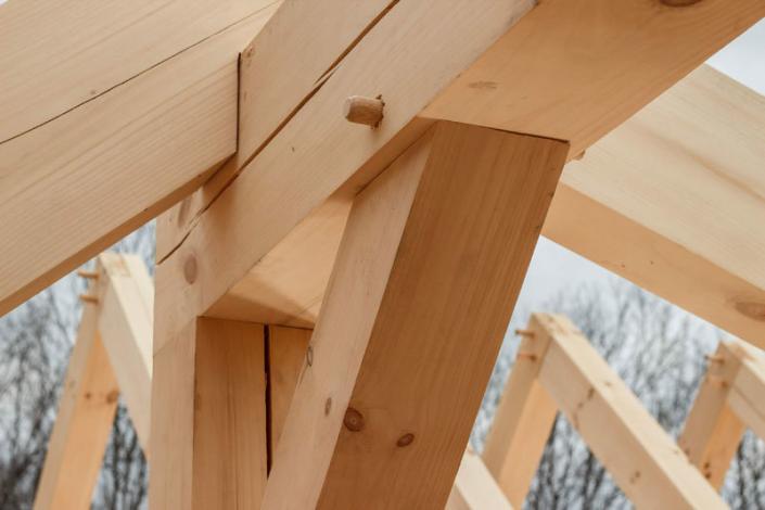 Timber frame angle brace and pegs