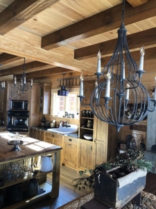kitchen cabinets and lighting, farmhouse inspired log home, log home, log home living, log home kitchen, Timberhaven, kiln dried