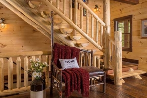 log stairs in foyer, Custom Log Home Features, log homes, log home living, timberhaven, log and timber home living