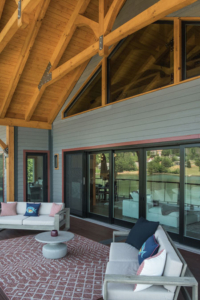 large porch with cathedral ceiling, timber trusses, lakehouse, modern touch of timber, timberhaven