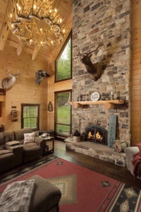 massive stone fireplace in great room, log home with stone in the woods, mountain log home, custom log home, Timberhaven, engineered logs, log homes in PA, kiln dried, custom home package