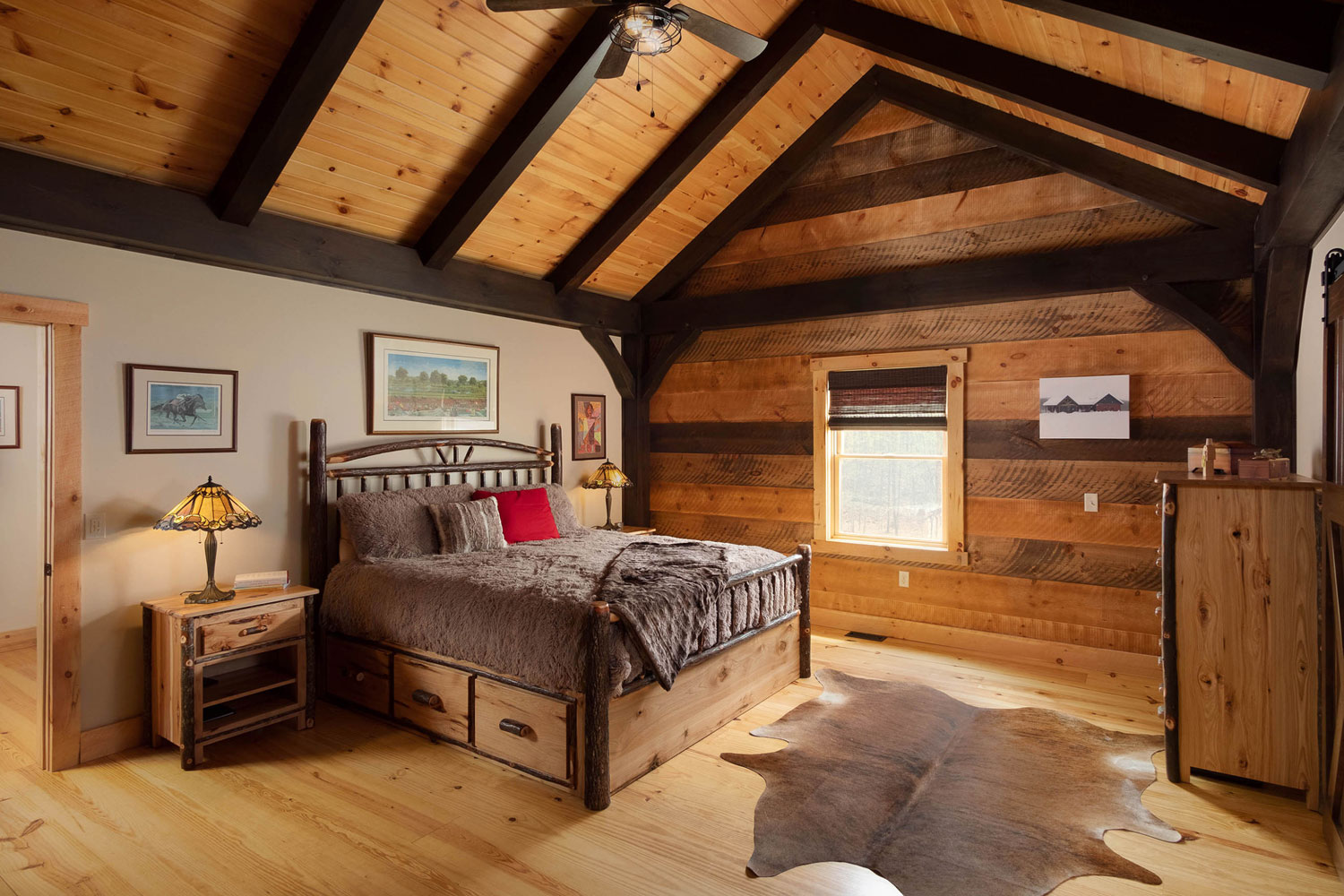 Exposed beams are highlighted in this bedroom