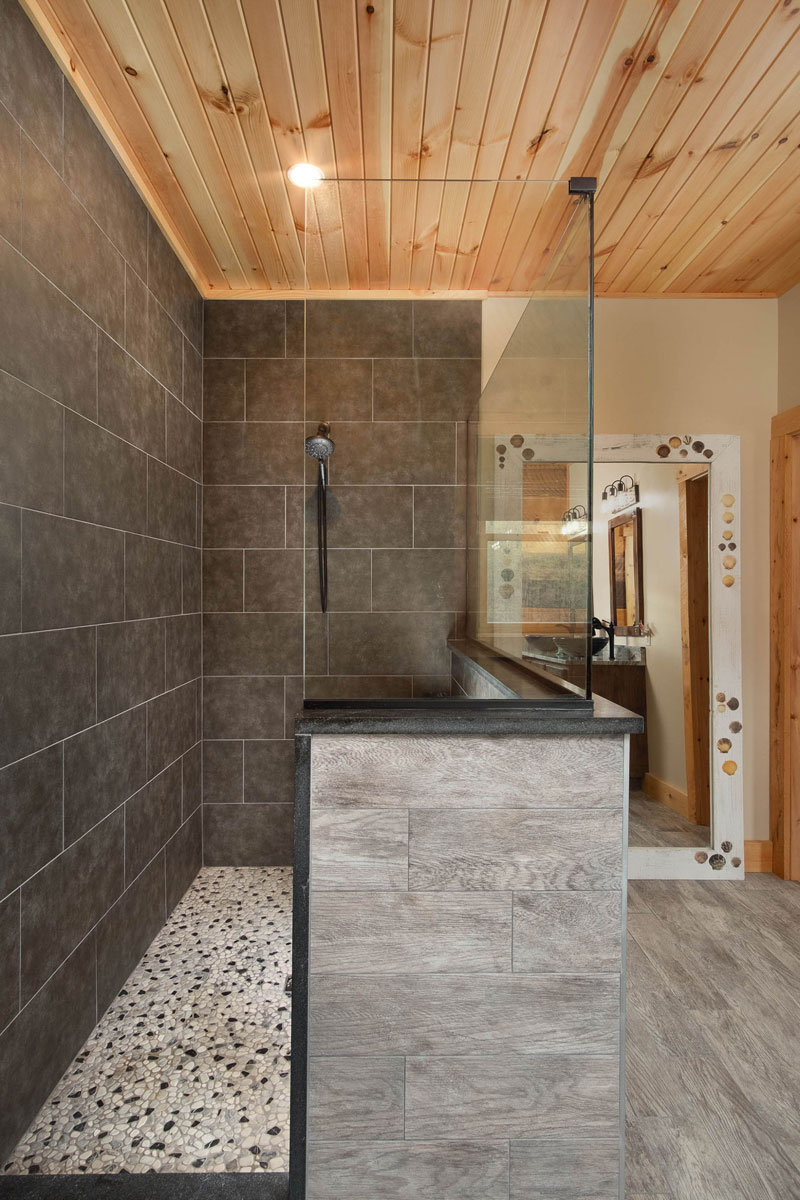 Spacious shower, seamless combo of wood and tile