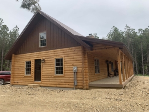 small log cabin with porch, Diamond Kote gable finish, log cabin, White Pine, Timberhaven