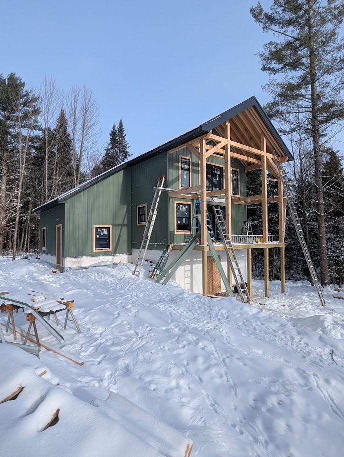 custom hybrid home with saltbox roof, metal finish