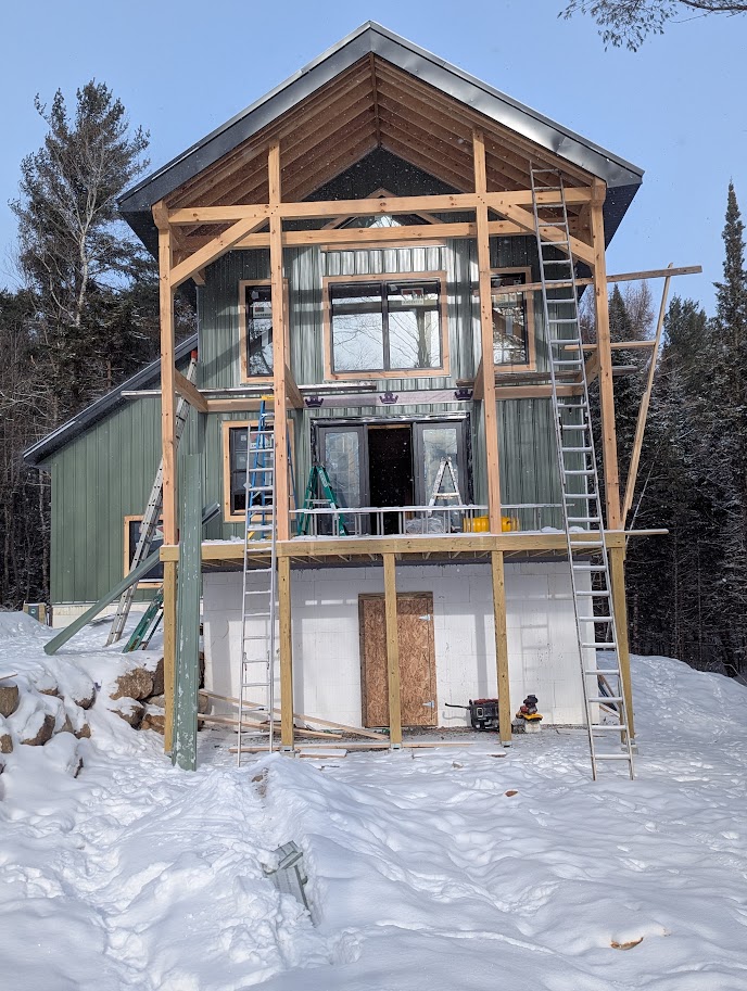 custom hybrid home with saltbox roof, metal finish