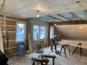tongue and groove installation in living area, Timber Frame Model Home Under Construction, Garage Renovation, Timberhaven
