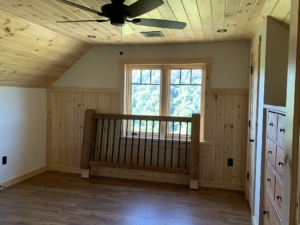 Timber Frame Model Home Under Construction, Bedroom with Wainscotting, Timberhaven
