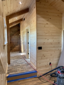 Timber Frame Model Home Under Construction, hallway, tongue and groove finish, Timberhaven