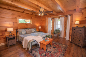 bedroom of log home, Timberhaven, log homes, magazine article, Lost & Found, Lewis Log Home