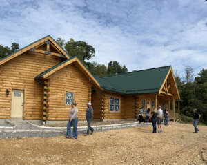 Saratoga Log Home being toured by guests, Timberhaven, parade of homes, log homes